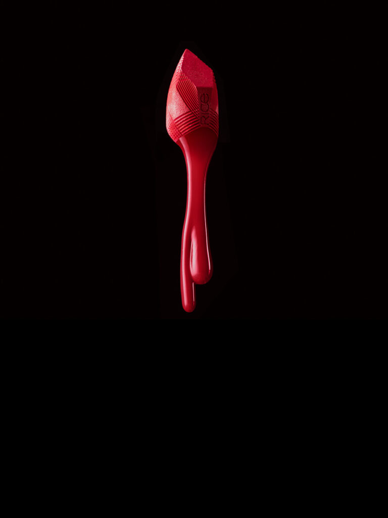 Künstlerisches Composit-Bild eines roten Lippenstifts mit fließender Farbe, professionell fotografiert von Ramon Riesen in Zürich
